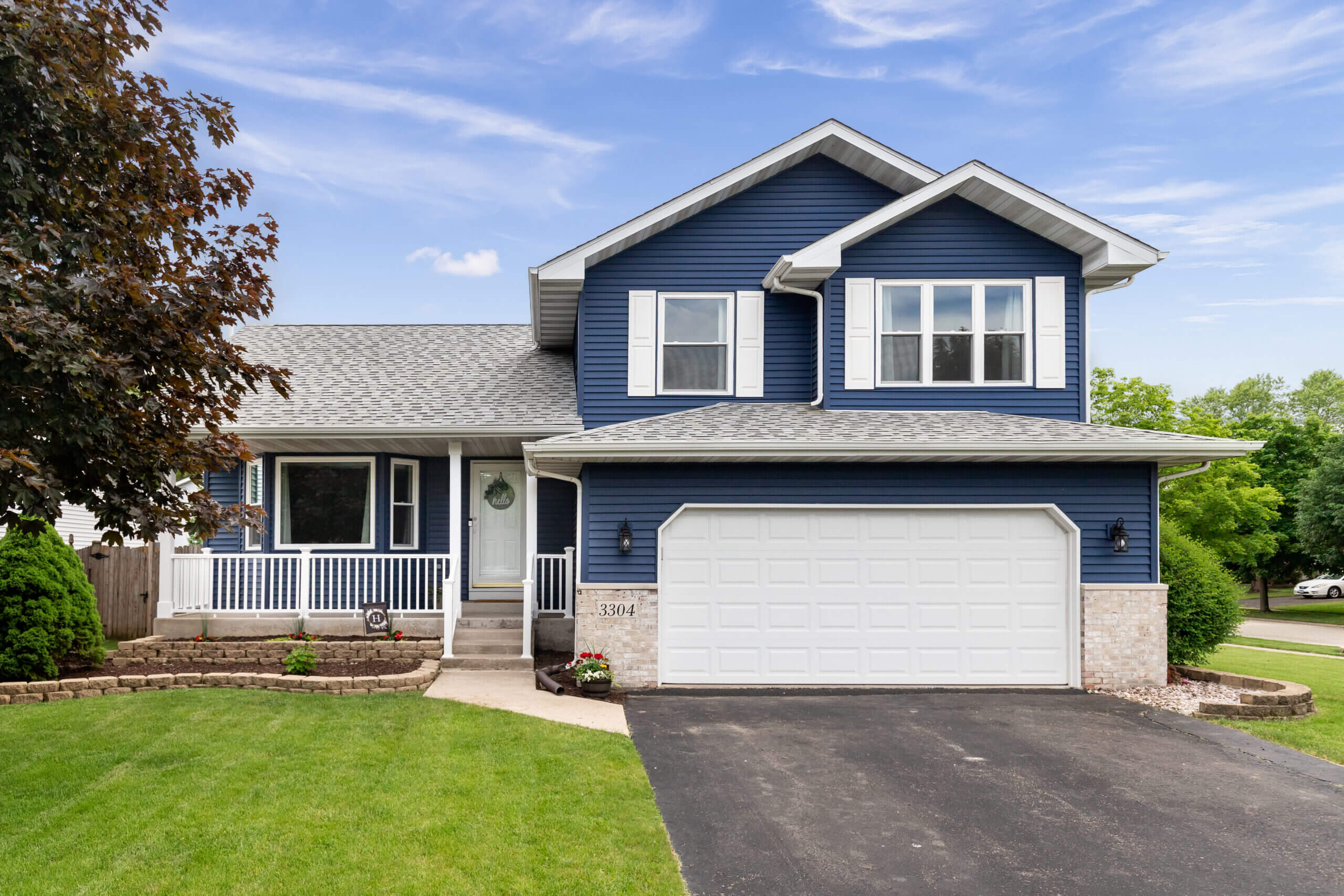 blue house with vinyl siding